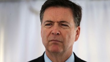 MIRAMAR, FLORIDA - APRIL 11:  FBI Director James Comey speaks to the media after holding a ceremony to commemorate a shoot-out thirty years after, FBI agents Ben Grogan and Jerry Dove died in a gun battle with two heavily armed suspected bank robbers in Miami-Dade county on April 11, 2016 in Miramar, Florida. The shootout left five other agents wounded and the two serial bank robbers were killed by one of the wounded FBI agents.  (Photo by Joe Raedle/Getty Images)
